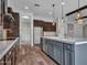 Spacious kitchen featuring stainless steel appliances and an open floor plan to the living area at 3809 E Lynx Pl, Chandler, AZ 85249