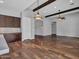 Bright and airy living room with hardwood floors, decorative beams and recessed lighting at 3809 E Lynx Pl, Chandler, AZ 85249