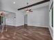 Large living room with hardwood floors, ceiling fan, and recessed lighting, providing ample space to relax at 3809 E Lynx Pl, Chandler, AZ 85249