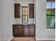 Office space complete with custom built-in cabinets, storage and natural light at 3809 E Lynx Pl, Chandler, AZ 85249