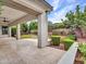 An inviting covered patio overlooks a lush backyard with manicured landscaping and ample space for outdoor entertaining at 3809 E Lynx Pl, Chandler, AZ 85249