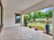 A covered patio offers a relaxing outdoor space with stone floors and views of the well-maintained backyard at 3809 E Lynx Pl, Chandler, AZ 85249