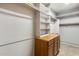 Well-organized walk-in closet featuring ample shelving and hanging space for storage at 38125 W Santa Clara Ave, Maricopa, AZ 85138