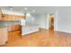 Kitchen offers wood cabinets, stainless steel appliances, and central island at 38125 W Santa Clara Ave, Maricopa, AZ 85138