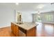 Kitchen boasts a central island with granite counters and stainless appliances at 38125 W Santa Clara Ave, Maricopa, AZ 85138