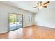 Open living room with sliding glass doors to the backyard and patio at 38125 W Santa Clara Ave, Maricopa, AZ 85138