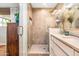 Bright bathroom with large glass shower, modern tile and neutral decor at 5919 S Newberry Rd, Tempe, AZ 85283