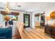 Cozy dining area with a decorative front door and hardwood floors at 5919 S Newberry Rd, Tempe, AZ 85283