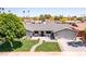Beautiful home featuring a well manicured yard, updated roof, and brick driveway and walkway at 5919 S Newberry Rd, Tempe, AZ 85283