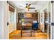 Spacious home office with a built-in desk, comfortable chair, and ample natural light at 5919 S Newberry Rd, Tempe, AZ 85283