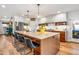 Modern kitchen features a large center island with seating and stainless steel appliances at 5919 S Newberry Rd, Tempe, AZ 85283