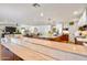 Open concept kitchen and living room with wood floors and island at 5919 S Newberry Rd, Tempe, AZ 85283