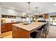 Open concept kitchen with large island and stainless appliances offers space for cooking at 5919 S Newberry Rd, Tempe, AZ 85283
