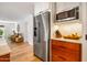 Gourmet kitchen with stainless steel refrigerator and custom cabinets shows high end finishes at 5919 S Newberry Rd, Tempe, AZ 85283