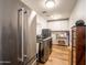 Well-equipped laundry room with modern washer and dryer, ample storage, and wood floors at 5919 S Newberry Rd, Tempe, AZ 85283