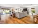 Bright living room featuring modern decor, wood floors, and sliding glass doors to backyard at 5919 S Newberry Rd, Tempe, AZ 85283