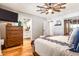 Bright main bedroom boasts a ceiling fan and ensuite bathroom access at 5919 S Newberry Rd, Tempe, AZ 85283