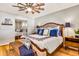 Well-lit main bedroom featuring a ceiling fan and full size mirrored closet at 5919 S Newberry Rd, Tempe, AZ 85283