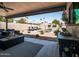 View of the inviting patio area overlooking a refreshing pool with lounge chairs and umbrellas at 5919 S Newberry Rd, Tempe, AZ 85283
