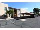Exterior shot of the apartment building with parking, showcasing the well-maintained grounds and architecture at 5998 N 78Th St # 222, Scottsdale, AZ 85250