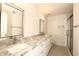 Modern bathroom features double sinks, granite countertops, and a glass-enclosed shower at 5998 N 78Th St # 222, Scottsdale, AZ 85250