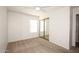 This bright bedroom features a ceiling fan and a closet with mirrored sliding doors at 5998 N 78Th St # 222, Scottsdale, AZ 85250