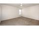 Spacious bedroom features a ceiling fan, neutral carpet, and a large window for natural light at 5998 N 78Th St # 222, Scottsdale, AZ 85250