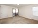 Large bedroom with carpet, slider to patio, and ceiling fan provides relaxing comfort at 5998 N 78Th St # 222, Scottsdale, AZ 85250