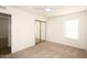 Neutral bedroom features carpet, ceiling fan, and a mirrored closet at 5998 N 78Th St # 222, Scottsdale, AZ 85250