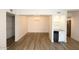 Open concept living and dining area with updated lighting fixtures and floors at 5998 N 78Th St # 222, Scottsdale, AZ 85250
