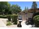 A community grilling area features multiple grills, a covered seating area, and well-maintained landscaping at 5998 N 78Th St # 222, Scottsdale, AZ 85250
