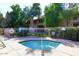 Inviting community hot tub features clear blue water and is surrounded by a wrought iron fence for safety at 5998 N 78Th St # 222, Scottsdale, AZ 85250