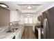 Contemporary kitchen featuring granite counters, stainless appliances, and ample cabinet space at 5998 N 78Th St # 222, Scottsdale, AZ 85250
