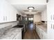 Galley kitchen with granite countertops, stainless steel appliances and modern white cabinets at 5998 N 78Th St # 222, Scottsdale, AZ 85250