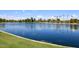 A vast, serene lake view showcasing clear blue water, lush trees, and expansive skyline, inviting nature's embrace at 5998 N 78Th St # 222, Scottsdale, AZ 85250