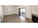 The living room with a fireplace and sliding glass door that opens onto a balcony at 5998 N 78Th St # 222, Scottsdale, AZ 85250