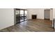 Bright living room features a fireplace and sliding glass door to the patio at 5998 N 78Th St # 222, Scottsdale, AZ 85250