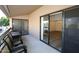 Relax on this covered patio with furniture, accessible through sliding glass doors at 5998 N 78Th St # 222, Scottsdale, AZ 85250