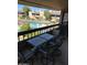 Cozy patio seating area offers a relaxing view of the community pool at 5998 N 78Th St # 222, Scottsdale, AZ 85250