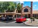 Exterior shot of townhomes with carport parking, brick accents, and landscaped grounds at 7977 W Wacker Rd # 220, Peoria, AZ 85381