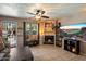 Cozy living room featuring a fireplace, ceiling fan, and tile flooring at 7977 W Wacker Rd # 220, Peoria, AZ 85381