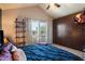 Serene main bedroom featuring a ceiling fan, a large window, and custom closet at 7977 W Wacker Rd # 220, Peoria, AZ 85381