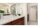 This bathroom features double sinks, sleek countertops, and modern fixtures and decorative accents at 805 E La Palta St, Queen Creek, AZ 85140