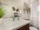 Bathroom with updated vanity, neutral color scheme and decor at 805 E La Palta St, Queen Creek, AZ 85140