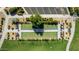 Aerial view of a meticulously kept bocce ball court surrounded by lush landscaping and convenient parking at 805 E La Palta St, Queen Creek, AZ 85140