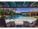 Inviting community pool offers a relaxing oasis with clear waters, palm trees, and comfortable lounge seating at 805 E La Palta St, Queen Creek, AZ 85140