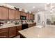 Gorgeous kitchen featuring granite countertops, backsplash design, and wood cabinetry at 805 E La Palta St, Queen Creek, AZ 85140