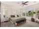 Serene main bedroom featuring plush carpet, ceiling fan, and neutral tones for a relaxing atmosphere at 805 E La Palta St, Queen Creek, AZ 85140