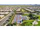 Aerial view of eight well-maintained tennis courts, a community amenity with beautiful green spaces at 805 E La Palta St, Queen Creek, AZ 85140