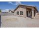The backyard features a gravel landscape and a block fence, providing a private outdoor space at 8733 W Laurel Ln, Peoria, AZ 85345